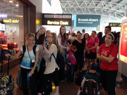 Waiting for their turn at the service desk for rebooked flights and hotel rooms, the #kentinprague group has a range of emotions.